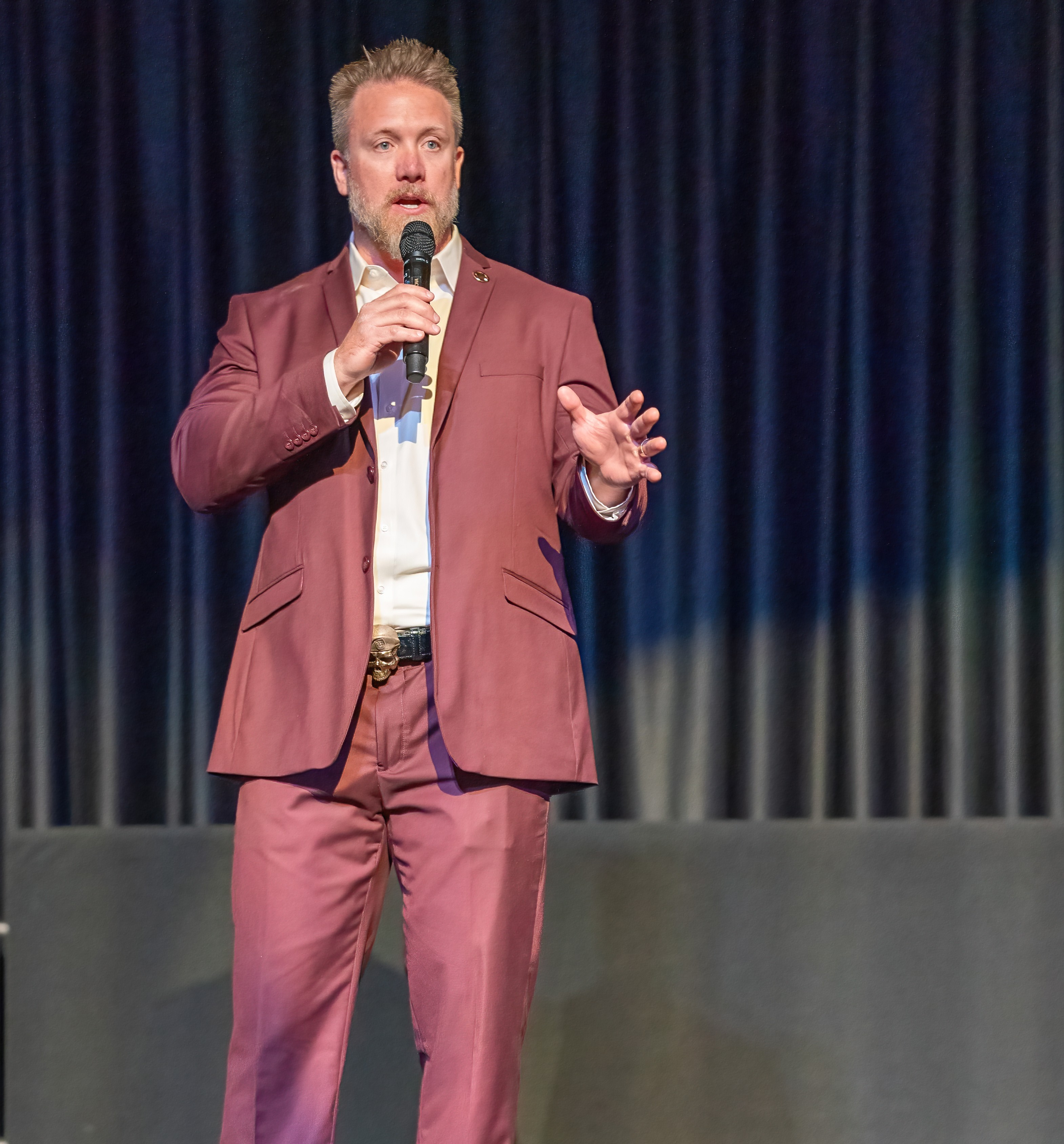 Jason Van Camp, Founder and Executive Director of Warrior Rising, speaking on stage